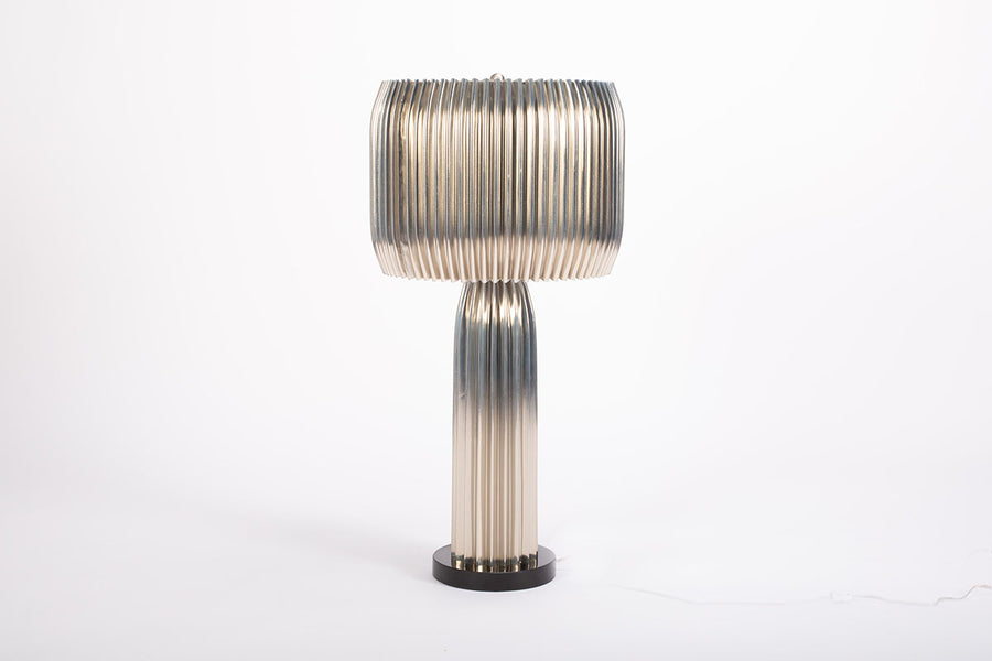 Bronze Crimp Table Lamp with hand crimped steel base and shade with a granite base in a geometric form.