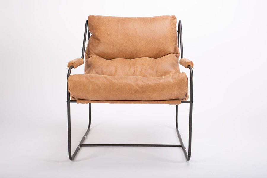 Brando contemporary lounge chair with industrial metal frame with a reclined back and plush feather down fill. Front view.