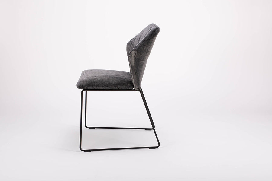 Black New York side chair with painted finish and fully removable covers. Side view.