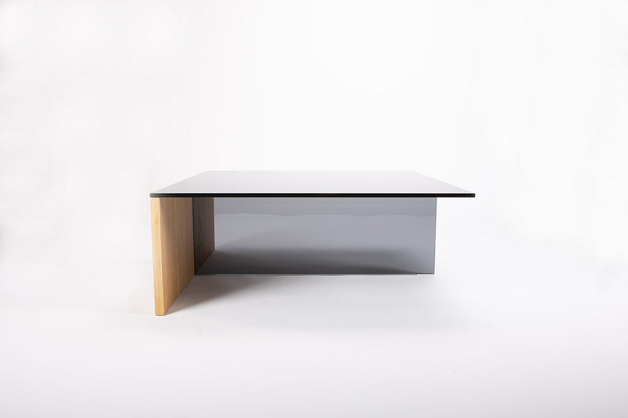 Square-topped Regolo Coffee Table with smoked glass element and wood base.