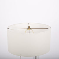 Abby table lamp with antique brass and crystal combined and a white shade. Closed up top view on a shade.