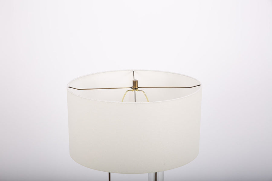 Abby table lamp with antique brass and crystal combined and a white shade. Closed up top view on a shade.