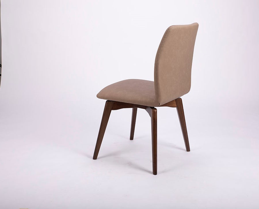 A beige Hexa swivel dining chair with wood base. Back and side view.