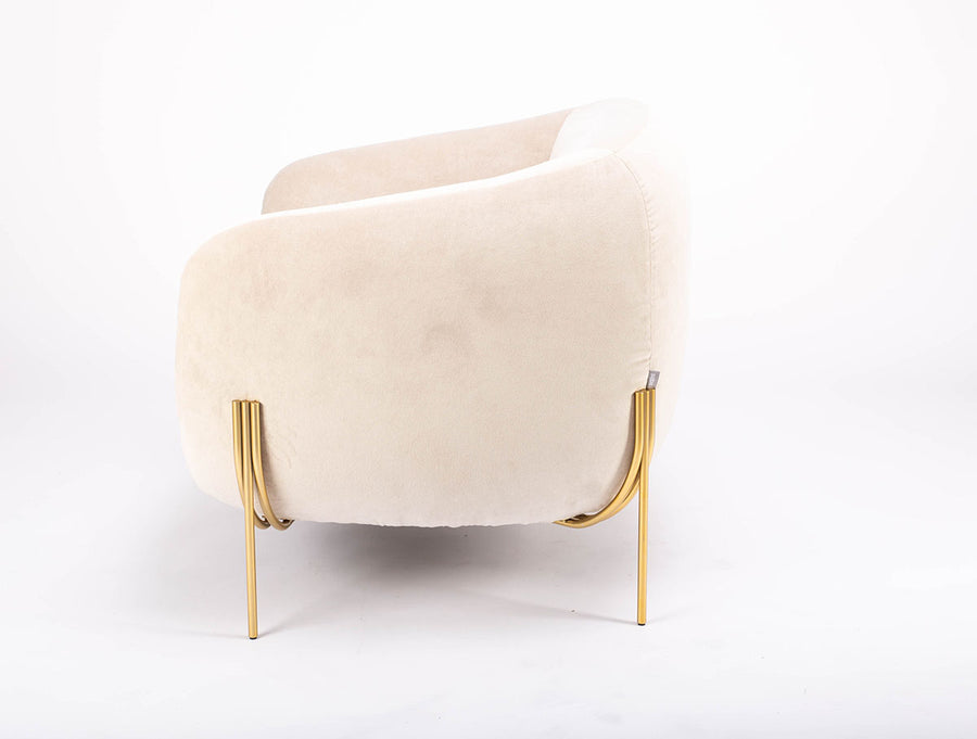 A white GEO lounge chair with light volume metallic legs, side view.