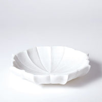 Marble Petal Bowl formed in snow white honed marble and pieces carved into petal-like shapes.