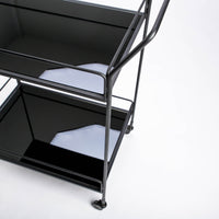 Two level Dixon Bar Cart with a heavy dose of lustrous mirror and garnished with streamlined metal frame. Closed up top view.